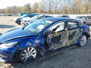 2019 Tesla Model 3 Long Range with VIN 5YJ3E1EB7KF454636, listed as a IAAI auction lot 41853972 with 56,916 mi miles. Bid and sale history available at carsss.com. Image 6.