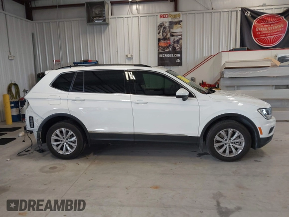 2018 Volkswagen Tiguan SEL z VIN 3VV3B7AX1JM167656, wystawiony jako IAAI lot #42658377 z przebiegiem 74 130 mil mil oraz . Historia ofert i sprzedaży dostępna na DreamBid. Obrazek 13.