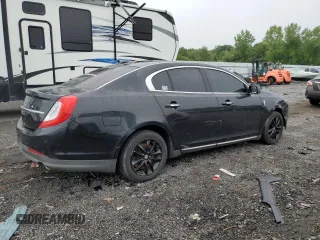 2015 Lincoln MKS z VIN 1LNHL9DK1FG601889, wystawiony jako Copart lot #60241635 z przebiegiem 249 283 mil mil oraz Czysty tytuł • Clean title. Historia ofert i sprzedaży dostępna na DreamBid. Obrazek 3.