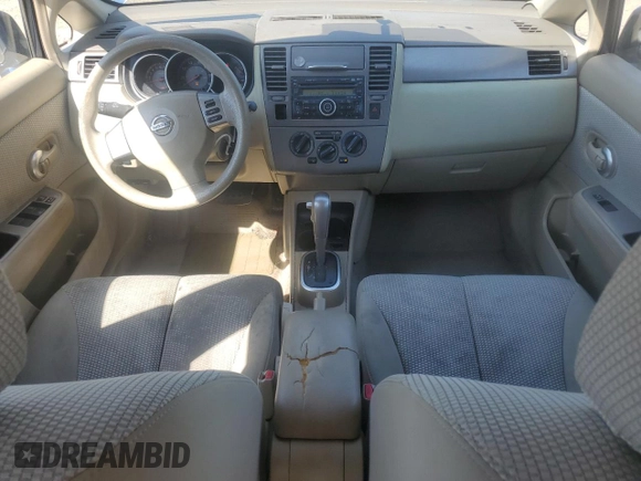 2007 Nissan Versa 1.8 SL with VIN 3N1BC11E27L432802, listed as a Copart auction lot 71018594 with 118,795 mi miles and Salvage Title. Bid and sale history available at carsss.com. Image 8.