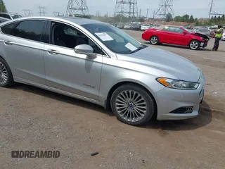 2013 Ford Fusion Titanium Hybrid with VIN 3FA6P0RU7DR281902, listed as a IAAI auction lot 42130457 with 148,677 mi miles and . Bid and sale history available at DreamBid. Image 1.