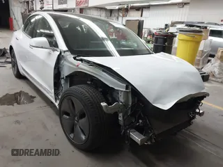 2020 Tesla Model 3 Standard Range Plus with VIN 5YJ3E1EA7LF805828, listed as a IAAI auction lot 41841505 with 44,946 mi miles and . Bid and sale history available at DreamBid. Image 1.