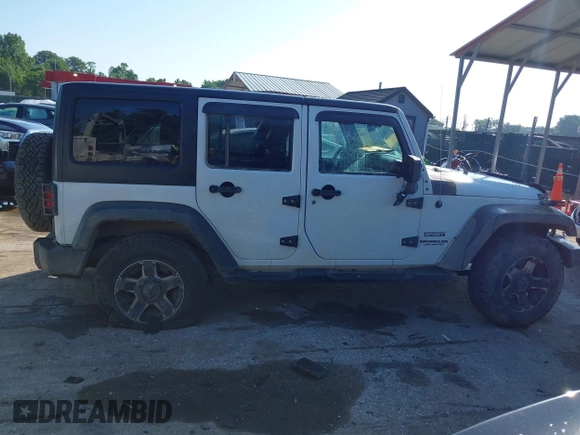 2016 Jeep Wrangler Unlimited Sport z VIN 1C4BJWDG5GL257423, wystawiony jako IAAI lot #42530026 z przebiegiem 157 072 mil mil oraz . Historia ofert i sprzedaży dostępna na DreamBid. Obrazek 13.