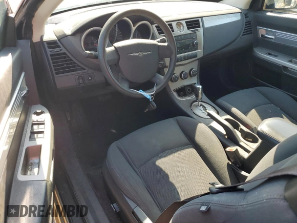 2010 Chrysler Sebring Touring z VIN 1C3BC5ED8AN166543, wystawiony jako Copart lot #56316984 z przebiegiem 78 655 mil mil oraz Szkoda całkowita • Salvage title. Historia ofert i sprzedaży dostępna na DreamBid. Obrazek 8.