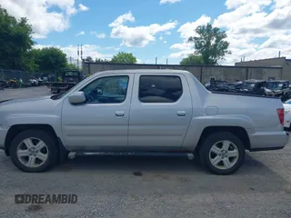2013 Honda Ridgeline RTL with VIN 5FPYK1F51DB007236, listed as a IAAI auction lot 42762126 with 201,758 mi miles and . Bid and sale history available at DreamBid. Image 14.