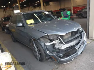 2018 BMW X5 xDrive40e iPerformance with VIN 5UXKT0C59J0V98760, listed as a IAAI auction lot 40983738 with 126,278 mi miles. Bid and sale history available at carsss.com. Image 1.
