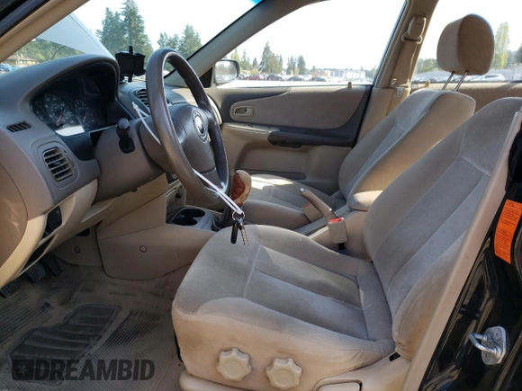 2003 Mazda Protege DX with VIN JM1BJ226231214537, listed as a Copart auction lot 54448615 with 147,753 mi miles and Salvage Title. Bid and sale history available at DreamBid. Image 7.