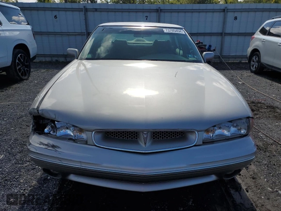 1997 Pontiac Bonneville SE z VIN 1G2HX52K7VH211607, wystawiony jako Copart lot #73705454 z przebiegiem 116 307 mil mil oraz Szkoda całkowita • Salvage title. Historia ofert i sprzedaży dostępna na DreamBid. Obrazek 5.