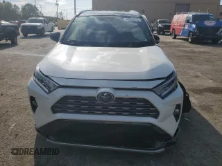 2021 Toyota RAV4 Hybrid XSE with VIN 2T3E6RFV1MW028094, listed as a Copart auction lot 52596615 with 68,497 mi miles and Salvage title. Bid and sale history available at DreamBid. Image 5.