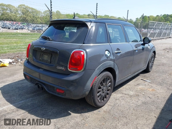 2017 MINI Hardtop 4 Door Cooper S z VIN WMWXU3C52H2D32498, wystawiony jako IAAI lot #42000212 z przebiegiem 70 231 mil mil oraz . Historia ofert i sprzedaży dostępna na DreamBid. Obrazek 4.