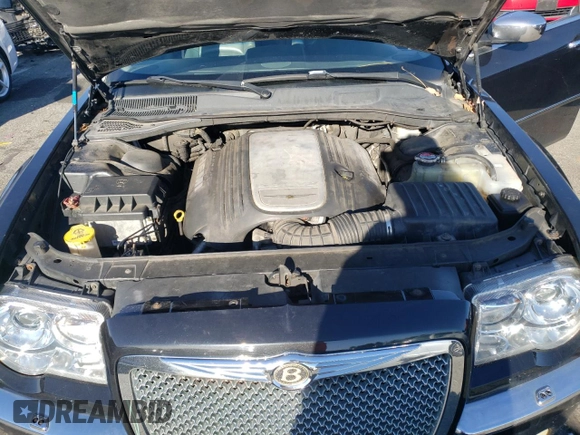 2005 Chrysler 300 300C AWD z VIN 2C3AK63H65H671814, wystawiony jako Copart lot #82867974 z przebiegiem 153 186 mil mil oraz Nie do naprawy. Historia ofert i sprzedaży dostępna na DreamBid. Obrazek 11.