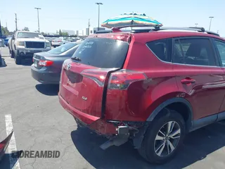2018 Toyota RAV4 XLE with VIN 2T3WFREV4JW505053, listed as a IAAI auction lot 42552459 with 94,552 mi miles and . Bid and sale history available at DreamBid. Image 4.