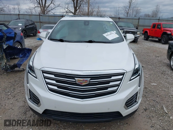 2019 Cadillac XT5 Premium Luxury FWD z VIN 1GYKNERS1KZ290754, wystawiony jako IAAI lot #41816074 z przebiegiem 91 585 mil mil oraz . Historia ofert i sprzedaży dostępna na DreamBid. Obrazek 12.