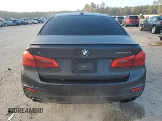 2019 BMW 5 Series M550i xDrive with VIN WBAJB9C57KB288906, listed as a Copart auction lot 79846274 with 61,744 mi miles and Salvage title. Bid and sale history available at DreamBid. Image 6.