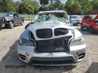 2012 BMW X5 35d with VIN 5UXZW0C51CL668064, listed as a Copart auction lot 62217845 with 140,544 mi miles and Salvage title. Bid and sale history available at DreamBid. Image 5.