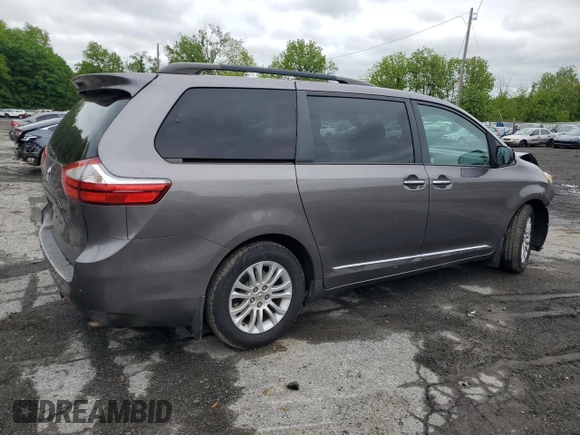 2015 Toyota Sienna XLE with VIN 5TDYK3DC4FS659692, listed as a Copart auction lot 57248355 with 121,644 mi miles and Salvage title. Bid and sale history available at DreamBid. Image 3.
