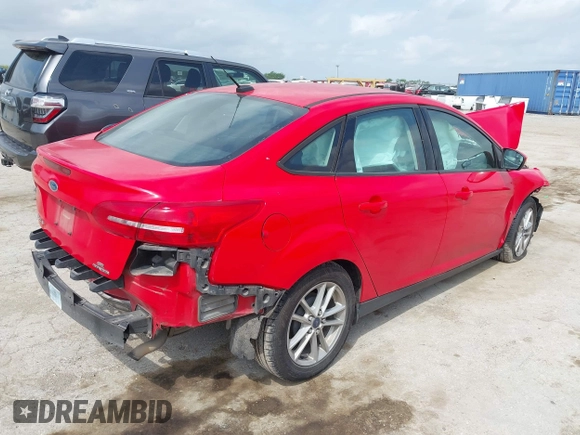 2015 Ford Focus SE z VIN 1FADP3F23FL233620, wystawiony jako IAAI lot #42073204 z przebiegiem 129 109 mil mil oraz . Historia ofert i sprzedaży dostępna na DreamBid. Obrazek 4.