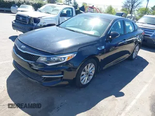 2016 Kia Optima LX with VIN 5XXGT4L3XGG013835, listed as a IAAI auction lot 41815349 with 120,628 mi miles and . Bid and sale history available at carsss.com. Image 2.