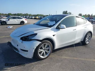 2021 Tesla Model Y Standard Range with VIN 5YJYGDED3MF103650, listed as a IAAI auction lot 41726278 with Not Provided miles and . Bid and sale history available at DreamBid. Image 2.