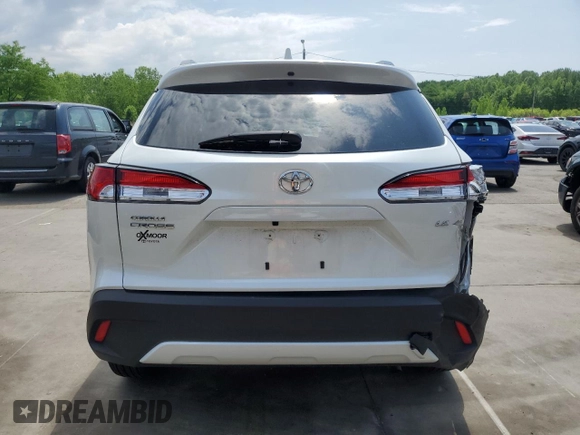 2023 Toyota Corolla Cross LE with VIN 7MUCAAAG2PV053730, listed as a Copart auction lot 54825035 with 33,313 mi miles and Salvage title. Bid and sale history available at DreamBid. Image 6.