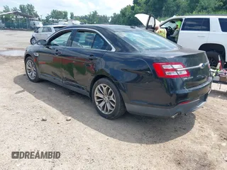 2013 Ford Taurus Limited z VIN 1FAHP2F85DG103747, wystawiony jako IAAI lot #42763099 z przebiegiem 181 891 mil mil oraz . Historia ofert i sprzedaży dostępna na DreamBid. Obrazek 3.