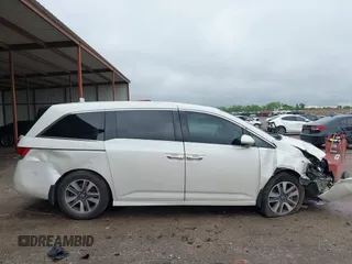 2014 Honda Odyssey Touring with VIN 5FNRL5H95EB059729, listed as a IAAI auction lot 42148110 with 135,304 mi miles and . Bid and sale history available at DreamBid. Image 14.