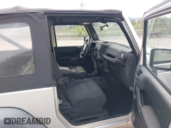 2011 Jeep Wrangler Sport with VIN 1J4AA2D18BL546069, listed as a IAAI auction lot 42139693 with 56,395 mi miles and . Bid and sale history available at carsss.com. Image 5.