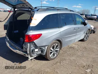 2018 Honda Odyssey Elite z VIN 5FNRL6H96JB004853, wystawiony jako IAAI lot #41877946 z przebiegiem 125 580 mil mil oraz . Historia ofert i sprzedaży dostępna na DreamBid. Obrazek 4.