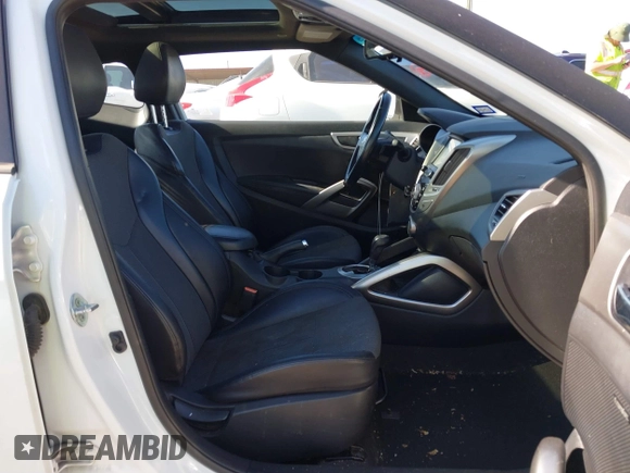 2016 Hyundai Veloster z VIN KMHTC6AD3GU267365, wystawiony jako IAAI lot #41469796 z przebiegiem 111 791 mil mil oraz . Historia ofert i sprzedaży dostępna na DreamBid. Obrazek 5.