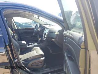 2014 Cadillac SRX Performance Collection z VIN 3GYFNCE35ES517868, wystawiony jako IAAI lot #41775522 z przebiegiem 166 960 mil mil oraz . Historia ofert i sprzedaży dostępna na DreamBid. Obrazek 5.