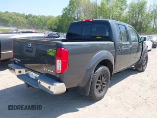 2014 Nissan Frontier SV with VIN 1N6AD0EV6EN729351, listed as a IAAI auction lot 42072768 with 149,158 mi miles and . Bid and sale history available at DreamBid. Image 4.
