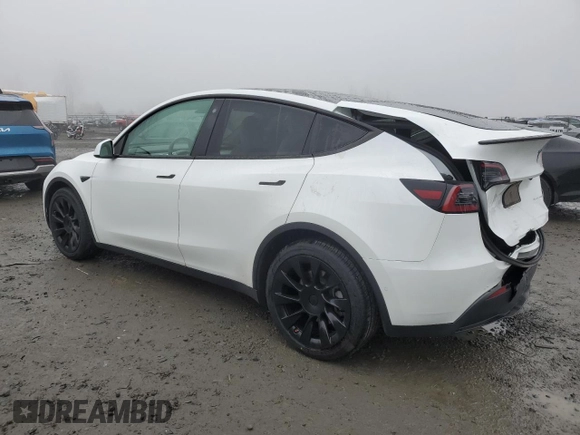 2021 Tesla Model Y Long Range with VIN 5YJYGDEE1MF267004, listed as a Copart auction lot 88708485 with 65,669 mi miles and Salvage Title. Bid and sale history available at DreamBid. Image 2.