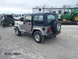 2001 Jeep Wrangler Sport z VIN 1J4FA49S31P349269, wystawiony jako IAAI lot #41427014 z przebiegiem 112 421 mil mil oraz . Historia ofert i sprzedaży dostępna na DreamBid. Obrazek 3.