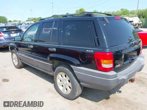 2001 Jeep Grand Cherokee Laredo with VIN 1J4GW48S31C558946, listed as a IAAI auction lot 42384392 with 252,393 mi miles and . Bid and sale history available at DreamBid. Image 3.