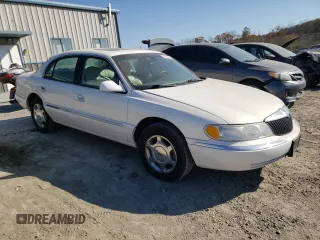 2002 Lincoln Continental with VIN 1LNHM97V62Y643532, listed as a Copart auction lot 76015984 with 154,374 mi miles and Salvage Title. Bid and sale history available at carsss.com. Image 4.