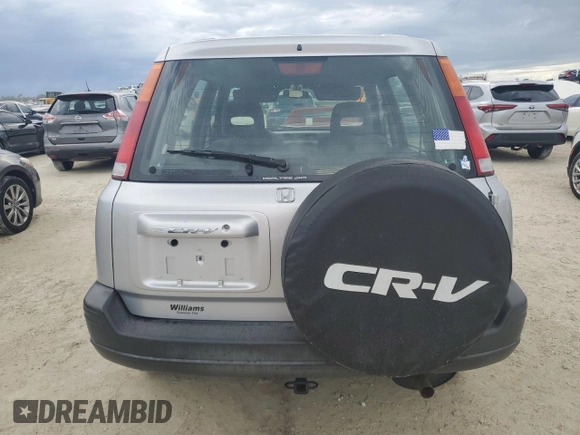 1999 Honda CR-V EX with VIN JHLRD1865XC064542, listed as a Copart auction lot 74730634 with 71,298 mi miles and Salvage Title. Bid and sale history available at carsss.com. Image 6.