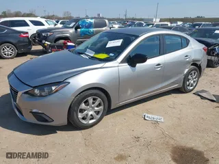 2014 Mazda Mazda3 i SV with VIN JM1BM1T77E1184656, listed as a IAAI auction lot 41703402 with 57,025 mi miles. Bid and sale history available at carsss.com. Image 17.
