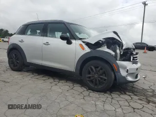 2012 MINI Countryman with VIN WMWZB3C5XCWM06778, listed as a Copart auction lot 61201285 with 64,676 mi miles and Salvage title. Bid and sale history available at DreamBid. Image 4.