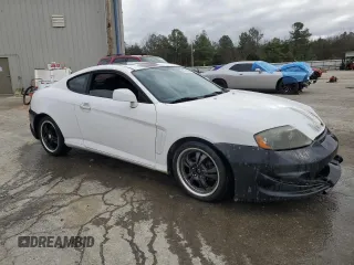 2003 Hyundai Tiburon z VIN KMHHM65D53U042971, wystawiony jako Copart lot #86919434 z przebiegiem 202 250 mil mil oraz Szkoda całkowita • Salvage title. Historia ofert i sprzedaży dostępna na DreamBid. Obrazek 4.