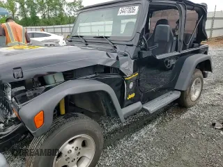 2002 Jeep Wrangler Sport with VIN 1J4FA49S12P730135, listed as a Copart auction lot 54477835 with 148,153 mi miles and Salvage title. Bid and sale history available at DreamBid. Image 14.