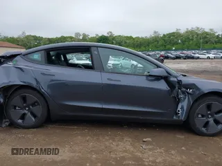 2023 Tesla Model 3 with VIN 5YJ3E1EA9PF673399, listed as a IAAI auction lot 42392643 with 7,571 mi miles and . Bid and sale history available at DreamBid. Image 14.