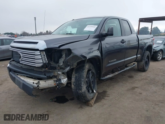 2014 Toyota Tundra SR with VIN 5TFUM5F16EX052444, listed as a IAAI auction lot 42298372 with 121,876 mi miles and . Bid and sale history available at DreamBid. Image 2.