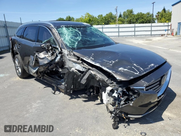 2018 Mazda CX-9 Grand Touring with VIN JM3TCADY5J0200052, listed as a Copart auction lot 55160715 with 68,464 mi miles and Salvage title. Bid and sale history available at DreamBid. Image 4.