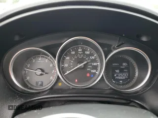 2015 Mazda CX-5 Sport z VIN JM3KE2BE4F0459532, wystawiony jako Copart lot #61049235 z przebiegiem 149 808 mil mil oraz Szkoda całkowita • Salvage title. Historia ofert i sprzedaży dostępna na DreamBid. Obrazek 9.