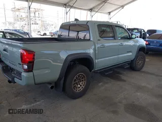 2022 Toyota Tacoma SR with VIN 3TMCZ5ANXNM479025, listed as a IAAI auction lot 42280363 with 29,650 mi miles and . Bid and sale history available at DreamBid. Image 4.