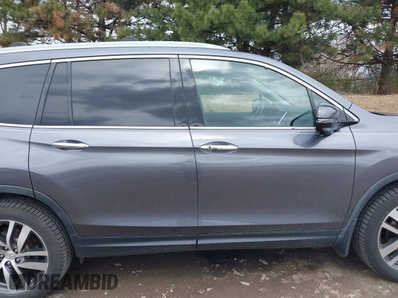 2017 Honda Pilot Touring with VIN 5FNYF6H92HB012090, listed as a IAAI auction lot 41882542 with 110,179 mi miles and . Bid and sale history available at DreamBid. Image 13.