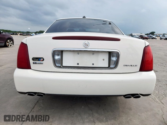 2004 Cadillac DeVille z VIN 1G6KD54Y04U111840, wystawiony jako Copart lot #56712195 z przebiegiem 60 378 mil mil oraz Szkody całkowita. Historia ofert i sprzedaży dostępna na DreamBid. Obrazek 6.