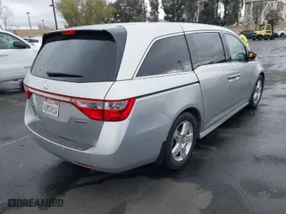 2012 Honda Odyssey Touring with VIN 5FNRL5H99CB055499, listed as a IAAI auction lot 41916534 with 278,435 mi miles. Bid and sale history available at carsss.com. Image 4.