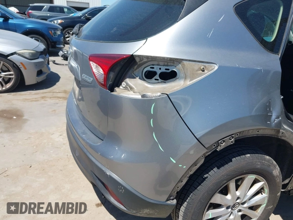 2014 Mazda CX-5 Sport with VIN JM3KE2BE7E0371203, listed as a IAAI auction lot 42243756 with 121,534 mi miles and . Bid and sale history available at DreamBid. Image 18.