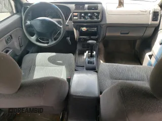 2000 Nissan Frontier XE with VIN 1N6ED27T5YC426456, listed as a Copart auction lot 54411425 with 117,600 mi miles and Salvage title. Bid and sale history available at DreamBid. Image 8.